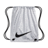 A silver Nike drawstring bag with a repeated multilingual soccer pattern and a large black swoosh logo on the front.