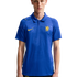 A young man wearing a blue Nike Chelsea FC polo shirt with yellow accents and an embossed club crest, set against a plain white background.