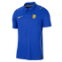 A blue Chelsea FC soccer jersey by Nike. Features a yellow swoosh and lion crest, a polo collar, and a tonal embossed pattern on the blue fabric.