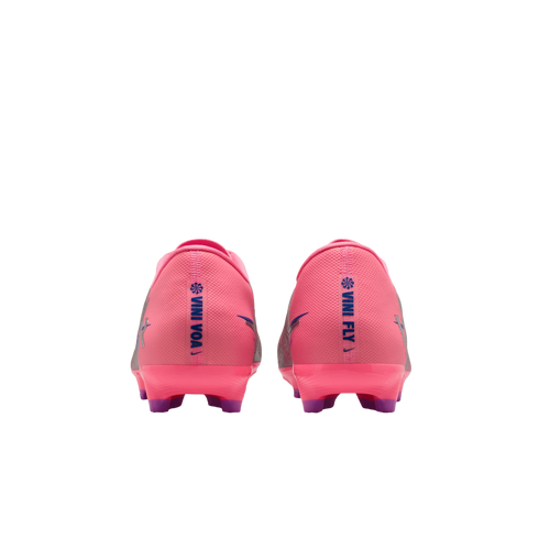 Rear view of pink Nike soccer cleats with blue vertical text "VINI VOA" and "VINI FLY" on the heels, against a black background.
