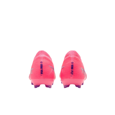 Heel view of two neon pink Nike soccer cleats. The left heel reads "VINI VOA" and the right "VINI FLY" in purple. Features translucent purple studs on a black background.