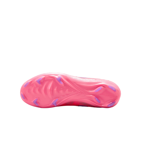The bottom view of a bright pink soccer cleat featuring purple studs and a textured soleplate, shown against a solid black background.