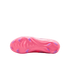 The bottom view of a bright pink soccer cleat featuring purple studs and a textured soleplate, shown against a solid black background.