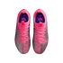 Top-down view of pink and metallic grey textured Nike football boots on a black background.