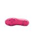 Bottom view of a pink soccer cleat showing its soleplate and purple studs against a black background.