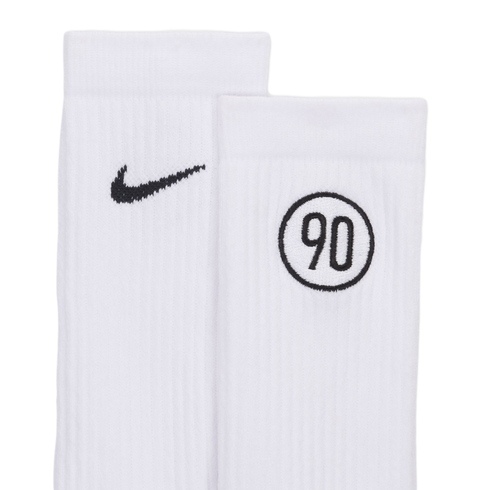 Close-up of two white ribbed Nike socks. One has a black Nike swoosh, and the other features a "90" inside a circle.