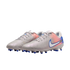 Light grey Nike soccer cleats with a pink and blue gradient heel, white swoosh, and blue studs on a black background.