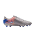 Side view of a light gray Nike soccer cleat with a pink and blue gradient design on the heel and blue studs, set against a black background.