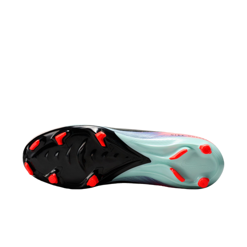 Bottom view of a Nike soccer cleat showing a black and light teal soleplate with bright red studs. The visible upper features a blue and pink mesh pattern.