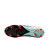 Bottom view of a Nike soccer cleat showing a black and light teal soleplate with bright red studs. The visible upper features a blue and pink mesh pattern.
