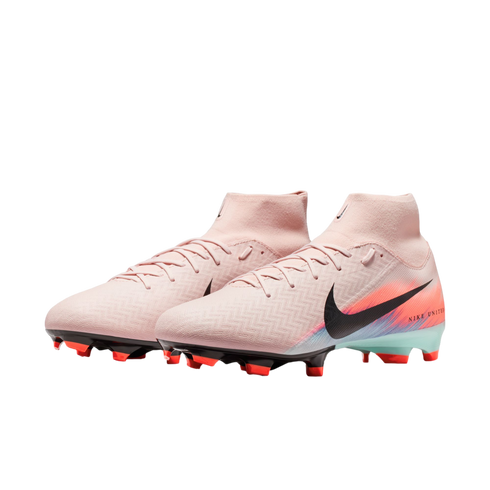 A pair of light pink Nike high-top soccer cleats with black swooshes, multicolored heel accents, and red studs, isolated against a solid black background.