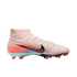 Side profile of a light pink Nike high-top soccer cleat featuring a black swoosh and vibrant orange and blue heel graphics, set against a black background.