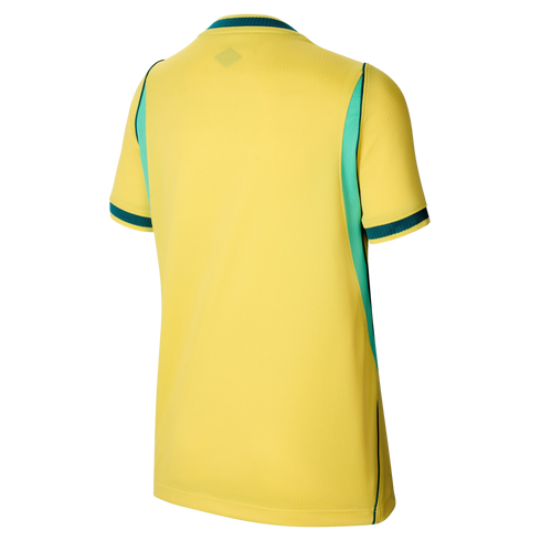 Back view of a yellow short-sleeved sports jersey with teal side panels and green and teal striped trim on the collar and cuffs.