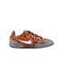 Nike indoor soccer shoe with an orange pixel-patterned upper, a silver swoosh, and metallic silver accents on the heel, toe, and sole.