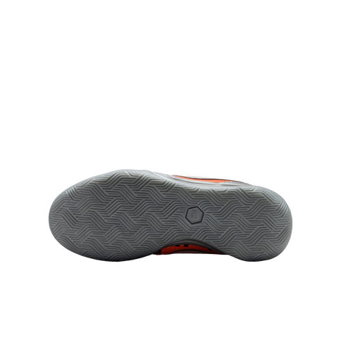 Bottom view of a Nike athletic shoe with a grey herringbone-patterned outsole. Orange and black accents are visible along the sides.