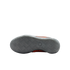 Bottom view of a Nike athletic shoe with a grey herringbone-patterned outsole. Orange and black accents are visible along the sides.