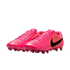 A pair of vibrant pink Nike soccer cleats with black swoosh logos, shown against a white background.