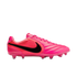Side view of a vibrant pink Nike soccer cleat with a black swoosh logo on a white background.