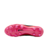 A bottom view of a pink Nike soccer cleat, showing a pink soleplate with round studs and a small black swoosh logo.