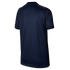 The back view of a dark blue short-sleeved athletic shirt with a subtle vertical ribbed texture, set against a solid black background.