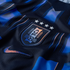 Close-up of a dark blue and black textured athletic jersey featuring an embroidered AUF (Uruguay) shield crest with four silver stars above it and a Nike swoosh logo below.