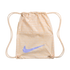 Peach-colored Nike drawstring bag featuring a light purple swoosh and a repeating white text pattern in various languages.