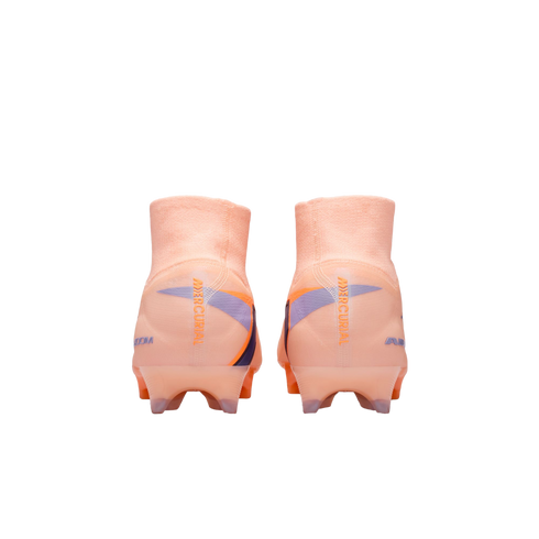 Rear view of peach Nike Mercurial soccer cleats with high-top collars and blue accents, set against a black background.