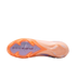 Underside of an orange and lavender Nike Air Zoom soccer cleat, displaying its unique stud pattern and "AIR ZOOM" branding against a black background.