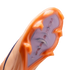Close-up of a Nike soccer cleat's orange and purple sole plate with "AIR ZOOM" text and translucent studs.