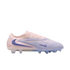 Side profile of a Nike Phantom GX soccer cleat in light pink and lavender with dark blue swooshes, displayed against a black background.