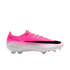 Side view of a pink and white Nike Flyknit soccer cleat featuring a large black swoosh and clear studs.