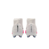 Rear view of white Nike Mercurial Superfly football boots with pink accents, showing vertical branding on the heels.