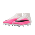 A pair of Nike soccer cleats featuring a pink and white gradient upper, black Nike swoosh, and a white sock-like collar.