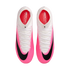 Top-down view of a pair of Nike Mercurial Superfly soccer cleats with a bright pink and white gradient upper, black Nike swooshes, and white laces.