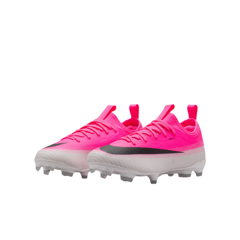 A pair of neon pink and white gradient Nike soccer cleats featuring a black swoosh and white studs, set against a plain white background.