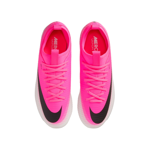 Top-down view of a pair of bright pink Nike Mercurial Vapor soccer cleats with black Nike swooshes and white-patterned soles, against a white background.