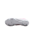 The white sole of a Nike soccer cleat features various traction studs and a faint Nike swoosh logo.