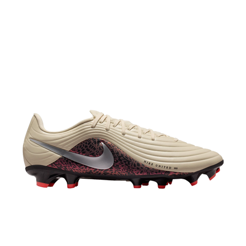 Side profile of a Nike United soccer cleat featuring a tan ridged upper, silver swoosh, and red-and-black patterned lower section against a black background.