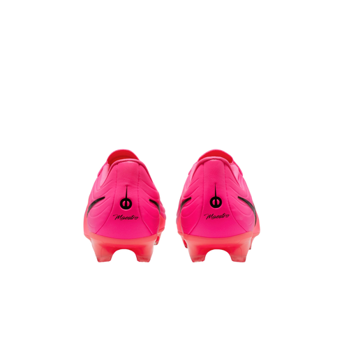 Rear view of bright pink soccer cleats with black "Maestro" branding on the heels, set against a plain white background.