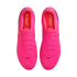 Top-down view of a pair of bright pink Nike soccer cleats with matching laces and red insoles on a white background.
