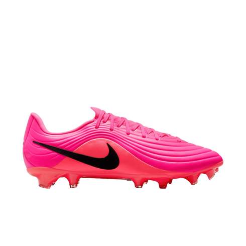 A side profile of a bright pink and red Nike soccer cleat with a black swoosh and textured upper against a white background.