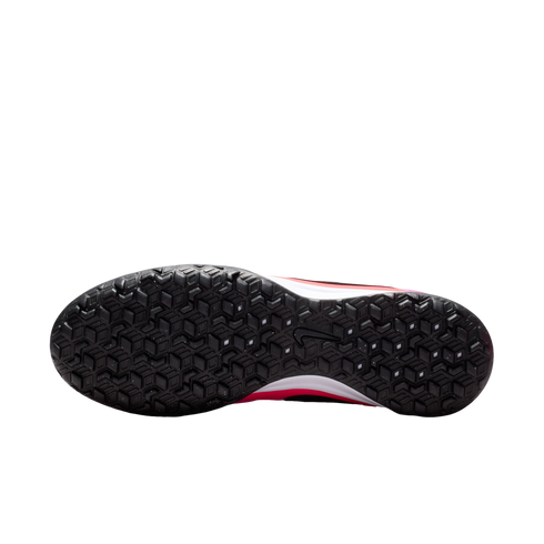 Bottom view of a Nike athletic shoe featuring a black textured rubber outsole with a geometric pattern, with pink and white accents on the midsole, against a white background.