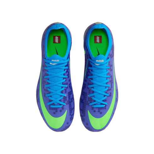 Overhead view of purple and blue Nike soccer cleats with a subtle LEGO brick pattern, lime green swooshes, and LEGO logos on the bright green insoles.