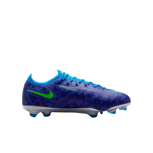 Profile of a blue Nike soccer cleat with a dark geometric pattern, neon green swoosh, blue laces, and a silver soleplate with blue studs on a white background.
