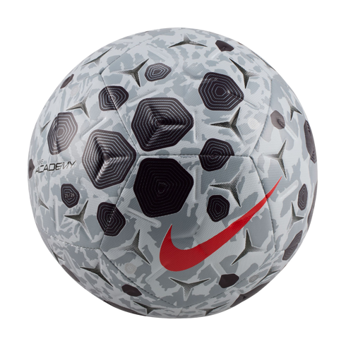 A Nike Academy soccer ball with a gray and black geometric pattern and a vibrant red swoosh logo, isolated against a solid black background.