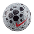 A Nike Academy soccer ball with a gray and black geometric pattern and a vibrant red swoosh logo, isolated against a solid black background.