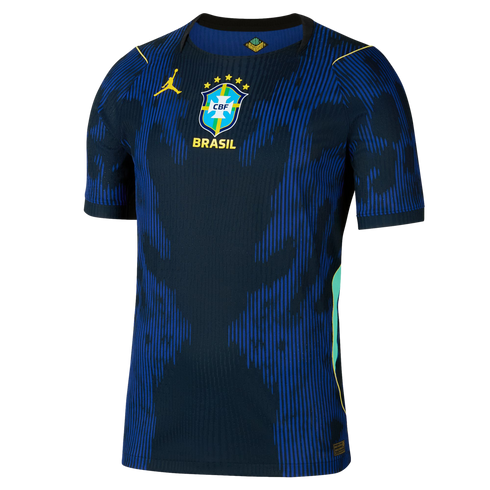 Dark blue Brazil national team soccer jersey featuring bright blue abstract stripes, a yellow Jumpman logo, and a central team crest with five stars.