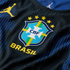 Close-up of a blue and black striped Brazil football jersey featuring the CBF crest, five gold stars, yellow "BRASIL" text, and a yellow Jordan Jumpman logo.
