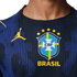 Close-up of a dark blue Brazil soccer jersey with a yellow Jordan logo and the CBF crest with five stars above the word "BRASIL".