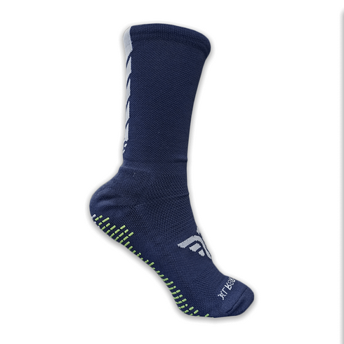A navy blue XLR8R Pro No Slip Sock featuring white chevron patterns on the back, a white side logo, and neon green and white grip pads on the sole.